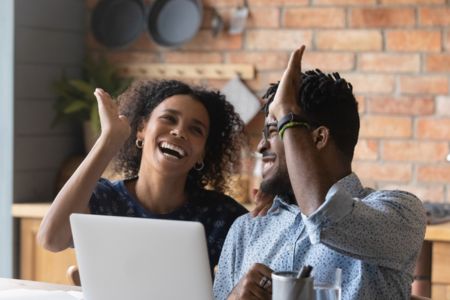 10_steps_to_financial_success_couple_high_fiving 10_steps_to_financial_success_couple_high_fiving