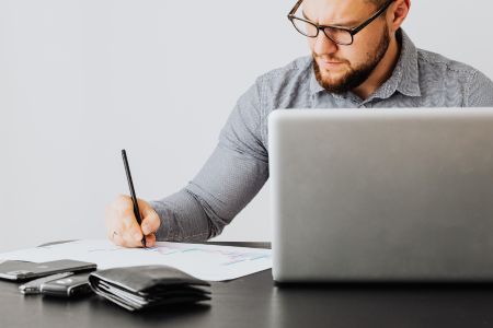 man working on finances