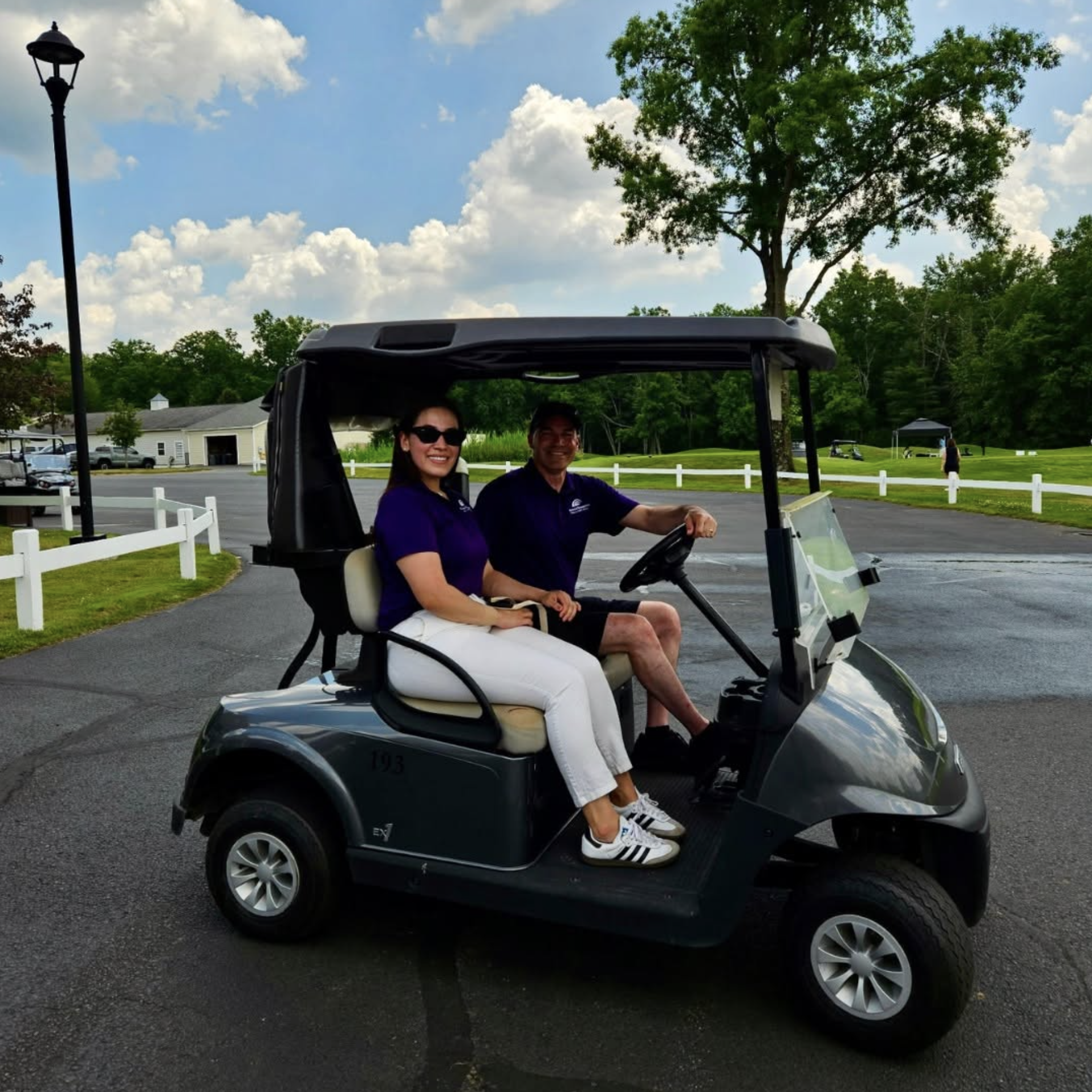 team FRFCU volunteers at the golf classic in a golf cart
