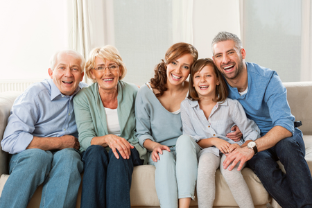 multi generation family sitting on the couch