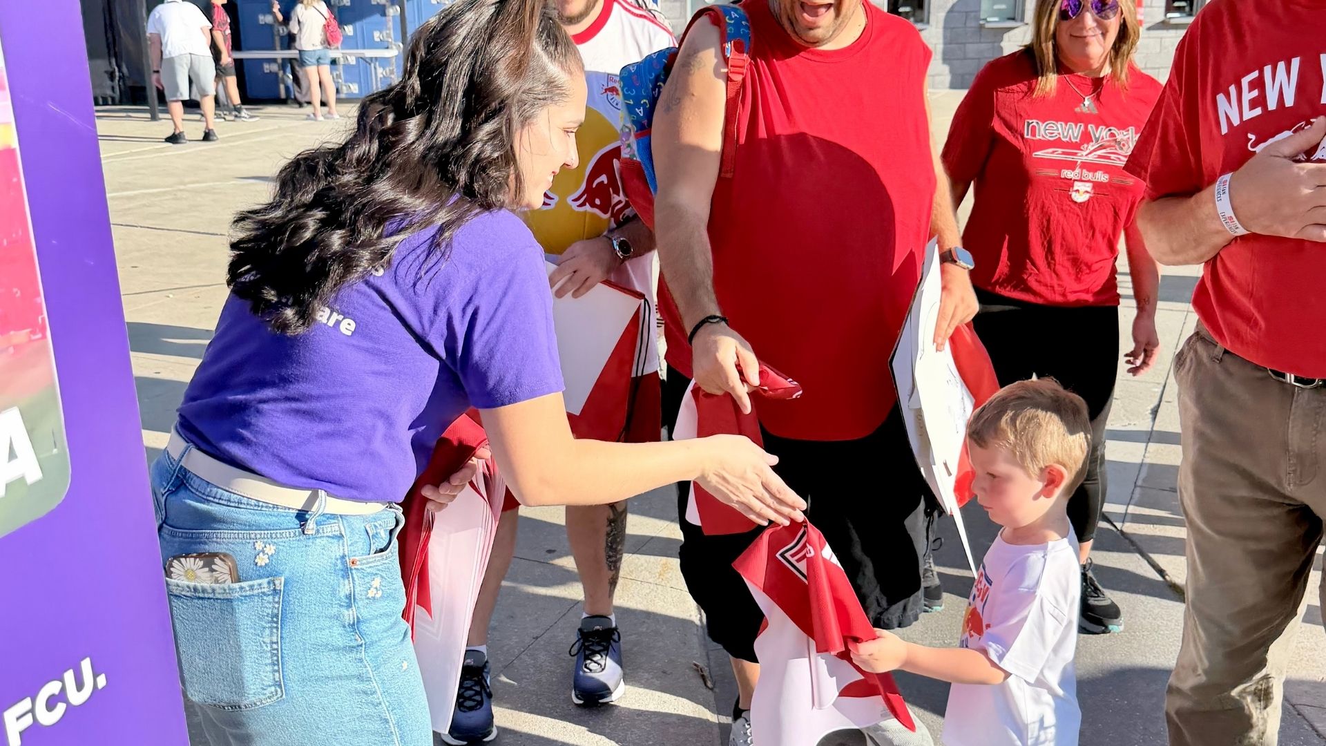 RBNY Mascot holding FRFCU towel